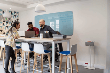 employees-collaborating-around-table